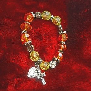 Green & orange bracelet with charms
